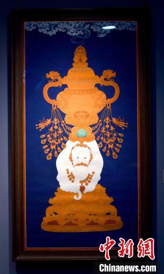 圖為5月16日，展覽中的新創(chuàng)唐卡作品《瑞象承香》?！±盍?攝